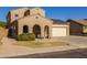 Two-story house with solar panels and a two-car garage at 16170 W Port Royale Ln, Surprise, AZ 85379
