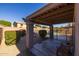 Covered patio overlooking a refreshing pool and fenced backyard at 16170 W Port Royale Ln, Surprise, AZ 85379
