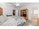 Second bedroom with a queen bed and built-in entertainment center at 16170 W Port Royale Ln, Surprise, AZ 85379