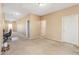 Long hallway with carpet, doors to bedrooms, and office space at 16170 W Port Royale Ln, Surprise, AZ 85379