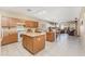 Kitchen with island and wood cabinets at 16170 W Port Royale Ln, Surprise, AZ 85379