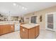 Kitchen with island and wood cabinets at 16170 W Port Royale Ln, Surprise, AZ 85379