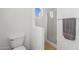 Small bathroom with shower and round window at 16170 W Port Royale Ln, Surprise, AZ 85379
