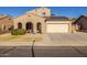 Two-story house with solar panels and a two-car garage at 16170 W Port Royale Ln, Surprise, AZ 85379
