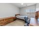 Cozy bedroom with a double bed, dresser, and desk at 16170 W Port Royale Ln, Surprise, AZ 85379