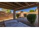 Relaxing covered patio with gravel landscaping and shrubs at 16170 W Port Royale Ln, Surprise, AZ 85379