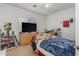 Small bedroom with a full-size bed and plenty of storage at 16170 W Port Royale Ln, Surprise, AZ 85379