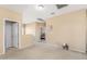 Upstairs hallway with doors to bedrooms and loft area at 16170 W Port Royale Ln, Surprise, AZ 85379