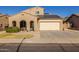 Two-story house with solar panels and a two-car garage at 16170 W Port Royale Ln, Surprise, AZ 85379