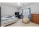 Spacious bedroom with a queen bed and workspace at 16170 W Port Royale Ln, Surprise, AZ 85379