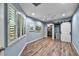 Bright bedroom with wood-look floors and a barn door closet at 12073 W Desert Mirage Dr, Peoria, AZ 85383