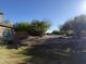 Landscaped backyard with a view of the community at 7313 S 17Th Dr, Phoenix, AZ 85041