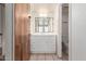 Bathroom with white vanity, tile floor and shower/tub combo at 949 N Revere St, Mesa, AZ 85201