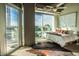 Bright bedroom with city view, large windows, and comfortable bed at 1 E Lexington Ave # 410, Phoenix, AZ 85012