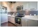 Stylish kitchen featuring updated appliances and cabinetry at 1 E Lexington Ave # 410, Phoenix, AZ 85012