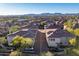 Aerial view showing a community of homes with roads and landscaping at 42424 N Gavilan Peak Pkwy # 53206, Anthem, AZ 85086