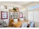 Bright dining area with a wood table and hutch at 16001 W Huron Dr, Sun City West, AZ 85375