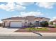 Single-story home with tile roof and landscaped front yard at 16001 W Huron Dr, Sun City West, AZ 85375