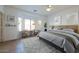 Bright bedroom with tiled floors and bay window at 42488 W Lucera Ct, Maricopa, AZ 85138