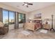 Cozy bedroom with wood bed frame, nightstand and large windows at 1842 N Red Clf, Mesa, AZ 85207