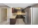 Updated kitchen featuring dark wood cabinets and granite countertops at 7402 E Carefree Dr # 209, Carefree, AZ 85377