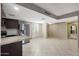 Spacious living area with tile floors and a view of the kitchen at 7402 E Carefree Dr # 209, Carefree, AZ 85377