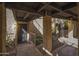Condo entry with covered walkway, access to unit 210, and well-maintained landscaping at 7402 E Carefree Dr # 209, Carefree, AZ 85377