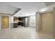 Open living room with tile floors and kitchen access at 7402 E Carefree Dr # 209, Carefree, AZ 85377