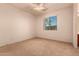 Well-lit bedroom with carpet and window at 15228 W Elm St, Goodyear, AZ 85395