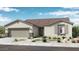 One-story home with a two-car garage and landscaped yard at 14314 W Alameda Rd, Surprise, AZ 85387