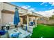 Outdoor dining area and sitting area in the backyard at 13349 N 87Th Ln, Peoria, AZ 85381
