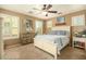 Bright bedroom with a queen-size bed and plenty of natural light at 13349 N 87Th Ln, Peoria, AZ 85381