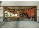 Two-car garage with overhead storage and shelving at 13349 N 87Th Ln, Peoria, AZ 85381
