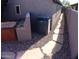 Backyard with hot tub, flagstone path, and gravel landscaping at 4506 E Lone Cactus Dr, Phoenix, AZ 85050