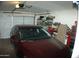 Garage with a car parked inside and plenty of storage at 4506 E Lone Cactus Dr, Phoenix, AZ 85050