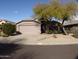 House exterior with a two-car garage and landscaped front yard at 4506 E Lone Cactus Dr, Phoenix, AZ 85050