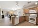 Open concept kitchen with island and views to living room at 28629 N Zircon Ct, San Tan Valley, AZ 85143