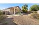 Landscaped backyard with gravel and a patio area at 28629 N Zircon Ct, San Tan Valley, AZ 85143