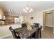 Kitchen dining area with granite table and black chairs at 28629 N Zircon Ct, San Tan Valley, AZ 85143