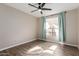 Bright bedroom with wood-look floors and ceiling fan at 9550 E Thunderbird Rd # 155, Scottsdale, AZ 85260