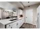 Modern kitchen with white cabinets, quartz countertops, and stainless steel appliances at 9550 E Thunderbird Rd # 155, Scottsdale, AZ 85260