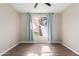 Well-lit bedroom featuring wood-look floors and window with curtains at 9550 E Thunderbird Rd # 155, Scottsdale, AZ 85260
