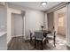 Cozy dining area with a round table and four chairs, near sliding doors to patio at 9550 E Thunderbird Rd # 155, Scottsdale, AZ 85260