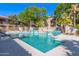 Inviting community pool with surrounding lounge chairs at 9550 E Thunderbird Rd # 155, Scottsdale, AZ 85260
