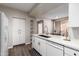 Well-equipped kitchen featuring white cabinets, and stainless steel appliances at 9550 E Thunderbird Rd # 155, Scottsdale, AZ 85260