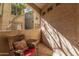 Private patio with wicker chair and side table, ideal for relaxing outdoors at 9550 E Thunderbird Rd # 155, Scottsdale, AZ 85260