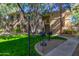 Two-story condo building with landscaping and grills at 9550 E Thunderbird Rd # 155, Scottsdale, AZ 85260