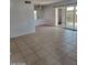 Spacious living room with tile floors and sliding glass doors at 5906 W Townley Ave, Glendale, AZ 85302