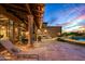 Spacious backyard patio with a pool and comfortable lounge chairs at 9533 E Rising Sun Dr, Scottsdale, AZ 85262