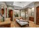 Luxurious bathroom with a soaking tub, walk-in shower, and double vanity at 9533 E Rising Sun Dr, Scottsdale, AZ 85262